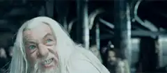 Saruman struck by Gandalf's staff