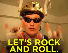 Cyclist in helmet and sunglasses says let's rock and roll