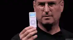 Steve Jobs holding an iPod
