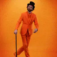 Man in orange suit dancing with cane
