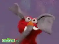 Elmo wearing elephant ears