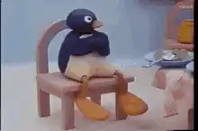 Pingu sitting on a chair