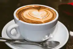 Latte art heart in white cup