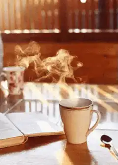 steaming coffee cup on table