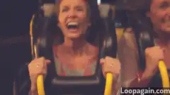 Woman screaming on roller coaster
