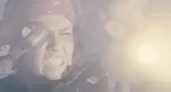 Woman firing a large gun