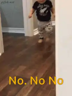 Toddler walking and shaking head no