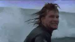Surfer screaming at a wave