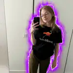 Woman with purple aura taking selfie