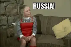 Sad girl sitting on couch with Russia text
