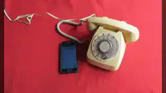 Person dials rotary phone
