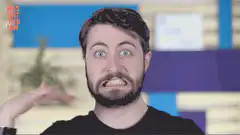 Man with wide eyes and bared teeth