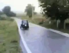 blue truck driving on road