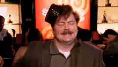 Ron Swanson dancing with a bottle on his head