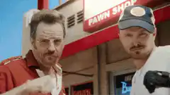 Heisenberg and Jesse dancing at the pawn shop