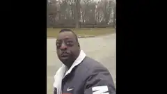 Man looking at camera then pointing