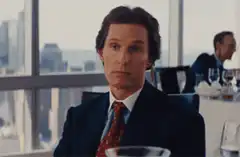 Gordon Gekko eating a grape