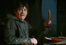 Samwell Tarly holding a sausage