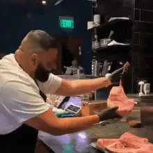 Chef slams steak onto grill