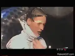 Man with glasses on head breathing fire