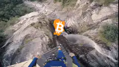 Bitcoin falling down a waterfall