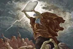 Moses holding tablets with flashing lights