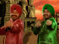 Men in colorful turbans dancing