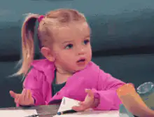 Confused little girl shrugging