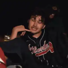 Man in Atlanta jersey making phone gesture