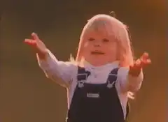 Toddler catches orange ball