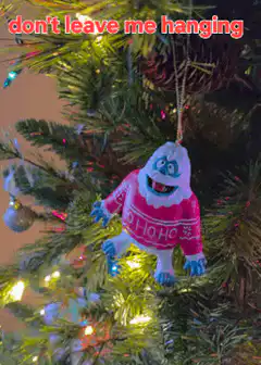 Yeti ornament swinging on Christmas tree