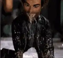 Jack Black spits out a mouthful of liquid
