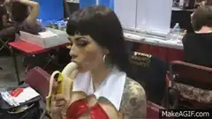 Cosplayer eats banana at convention