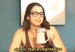 Woman drinking from mug impressed