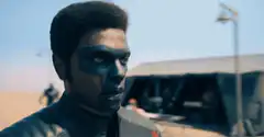 Ayo stands in desert battle