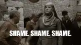 Woman chanting shame shame shame