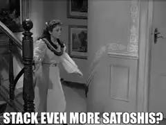 woman stacking satoshis
