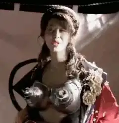 Woman in ornate armor with braided hair