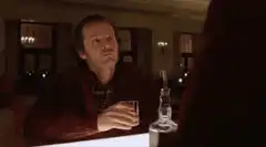 Jack Nicholson holding a drink and smiling