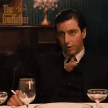 Michael Corleone smoking at dinner