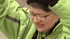 Man in green jacket screaming