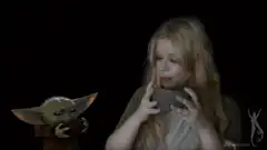Woman and Baby Yoda drinking from bowls