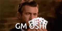 Mel Gibson holding cards GM OSHI
