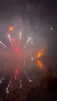 fireworks over water at night