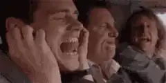 Man screaming with hands over ears
