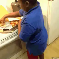 Boy eating pizza and dancing