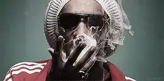 man in beanie smoking