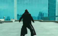 Neo dodging bullets on rooftop