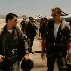 Maverick and Goose high five on tarmac