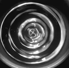 Black and white swirling liquid vortex